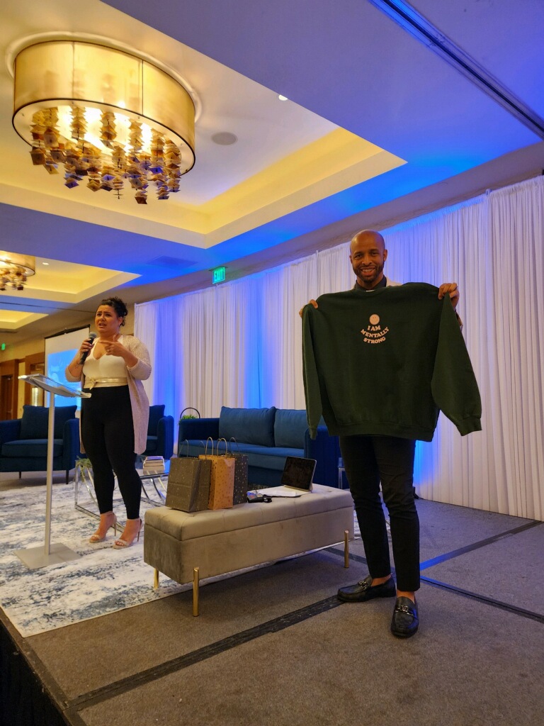 True Vision team celebrating reaching their fundraising goal for the Hands-In mental health initiative