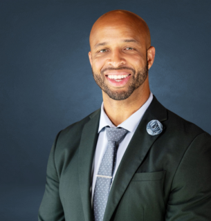 Dewayne Long, CEO and Founder of True Vision Enterprises, smiling in professional attire